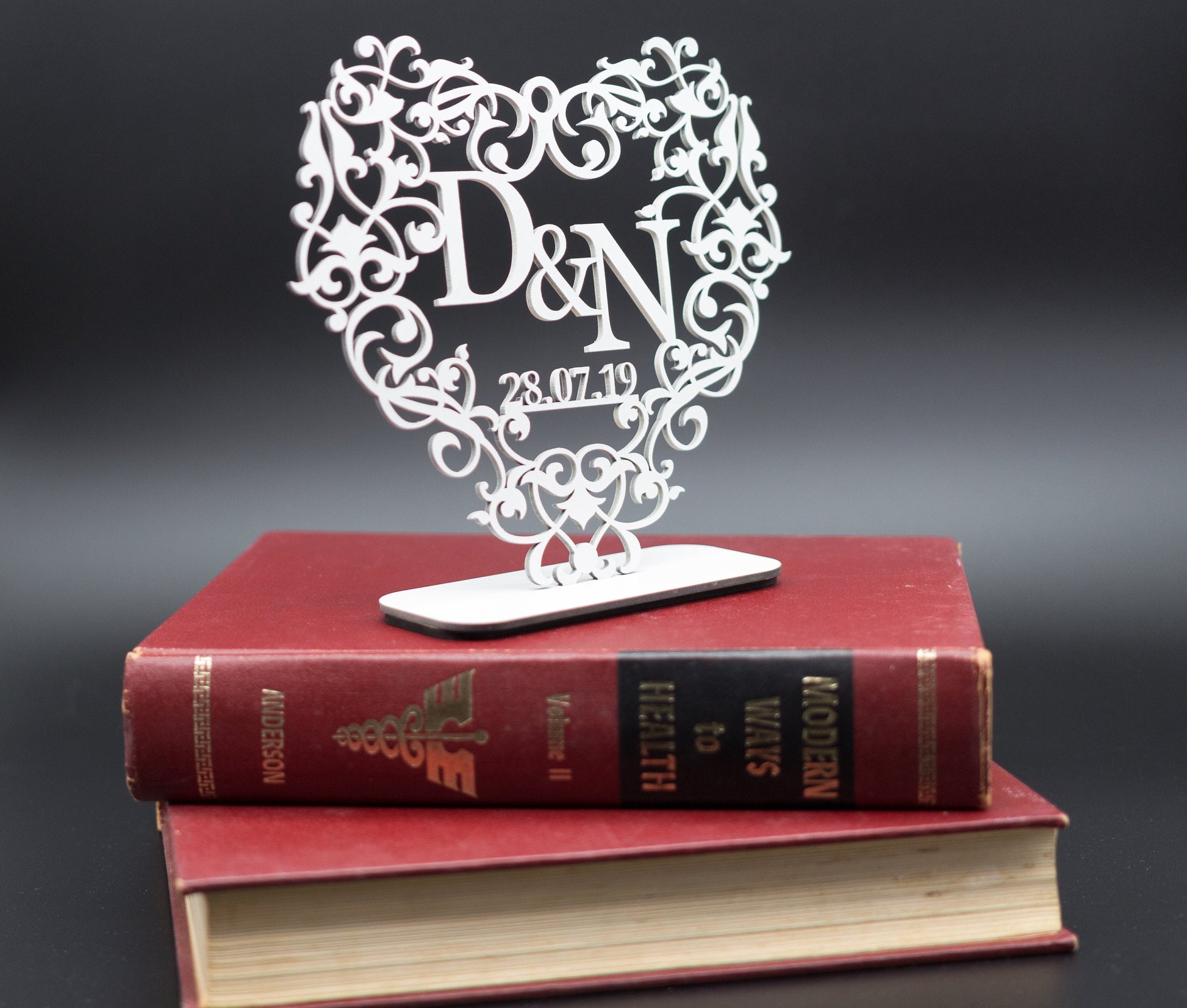 Acrylic heart with initials and date.