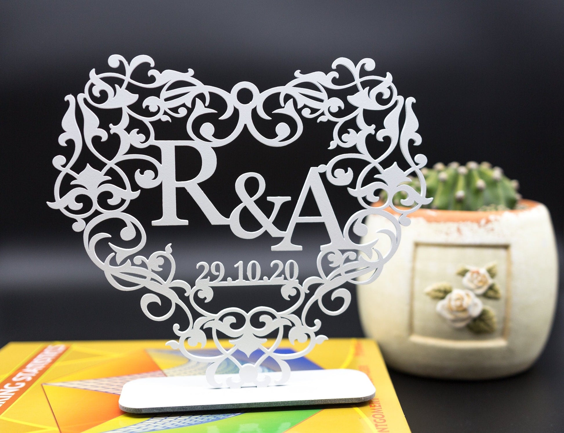 Acrylic heart with initials and date.