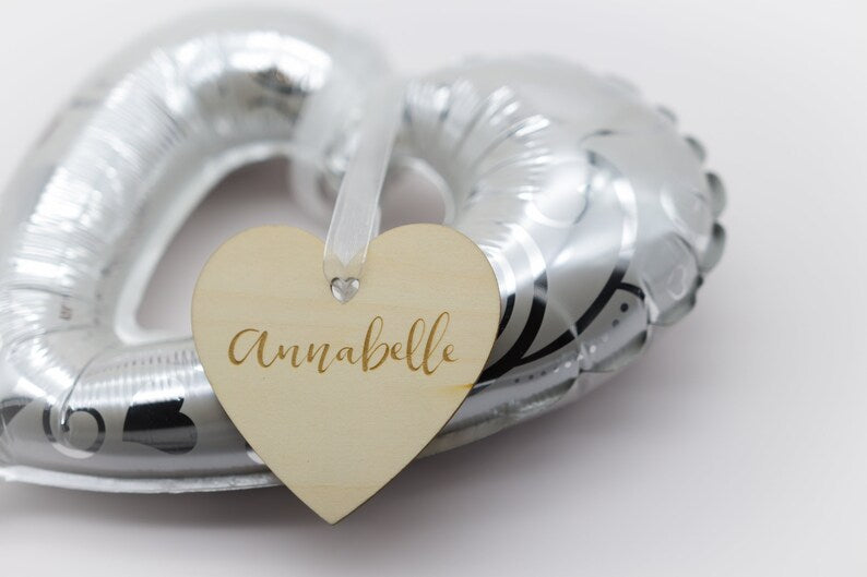 Engraved heart tag on balloon.